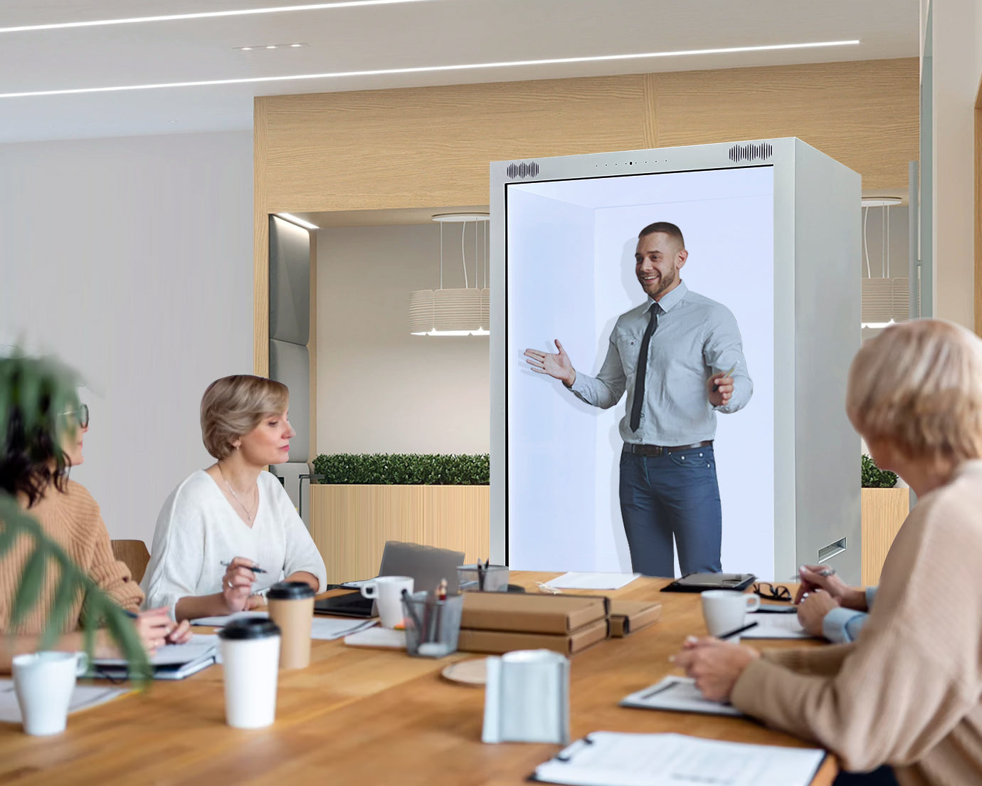 Group of people in a conference room with Holobox